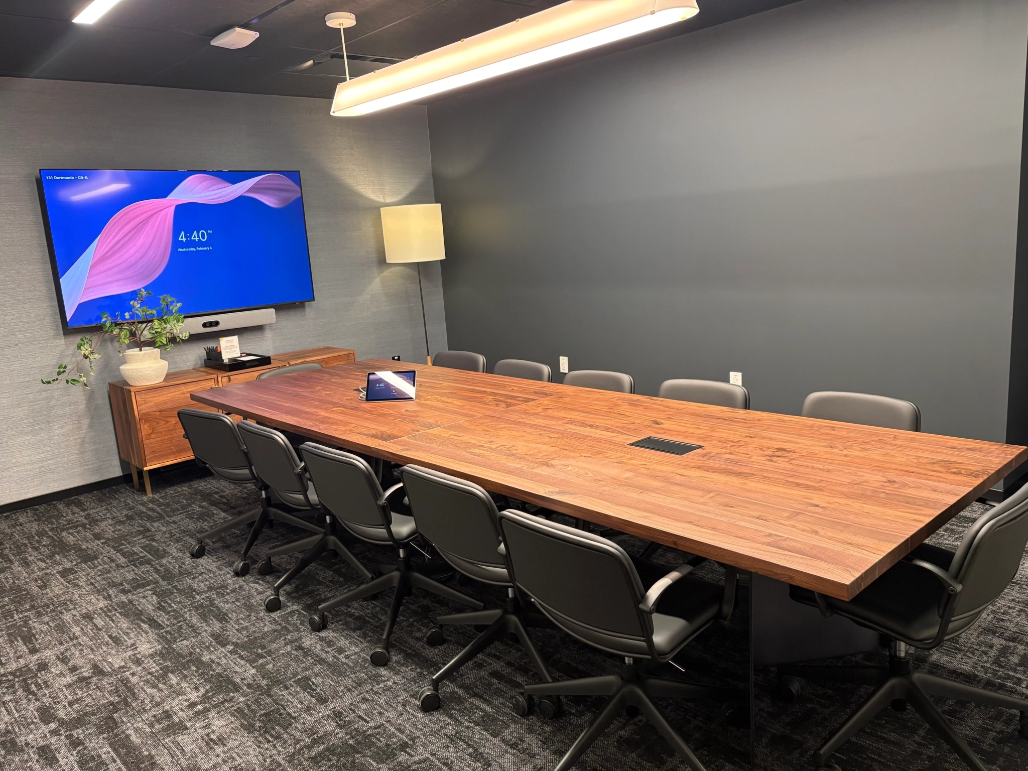 a large, bright meeting room with a large screen