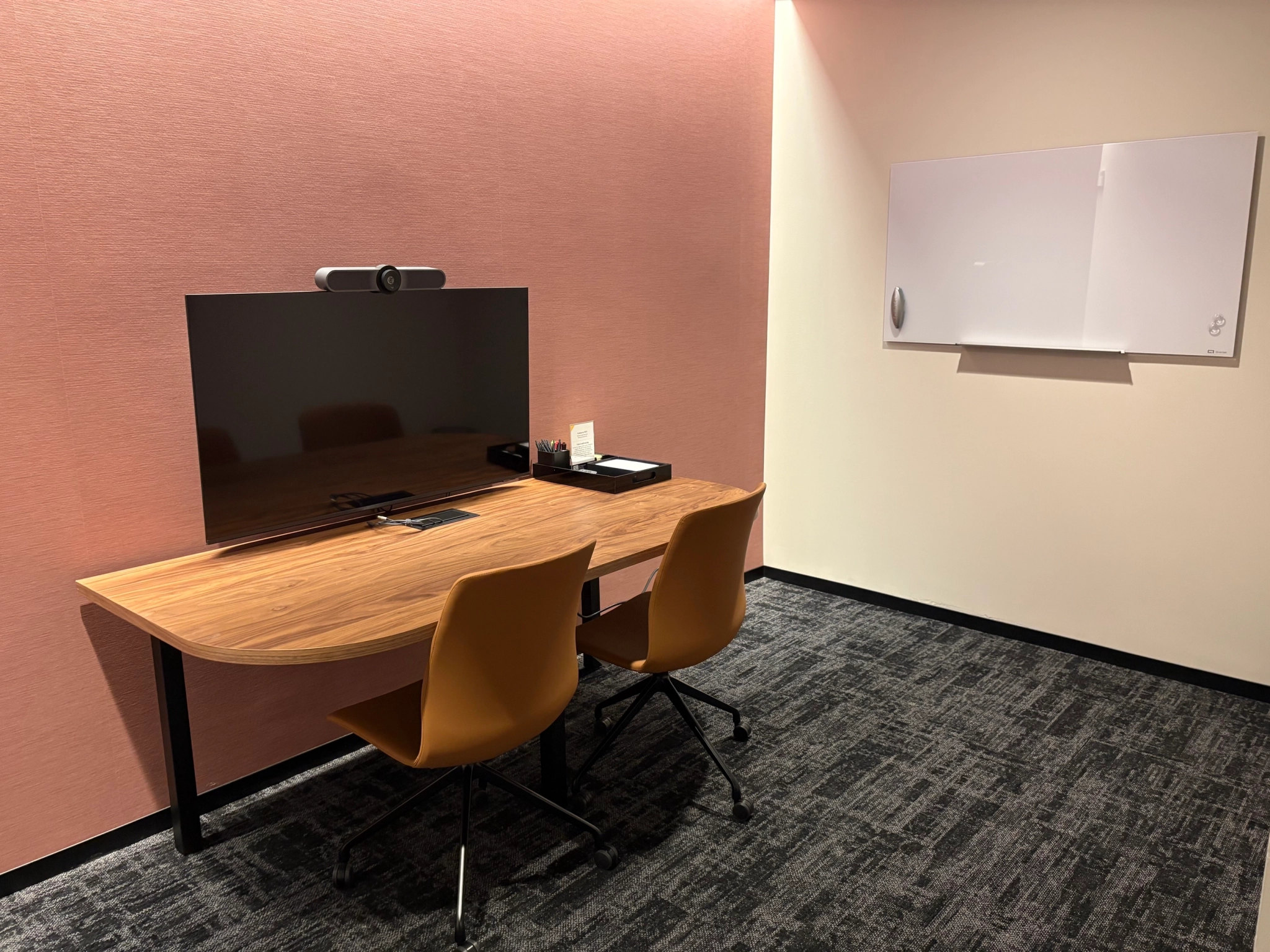 a large, bright meeting room with a large screen