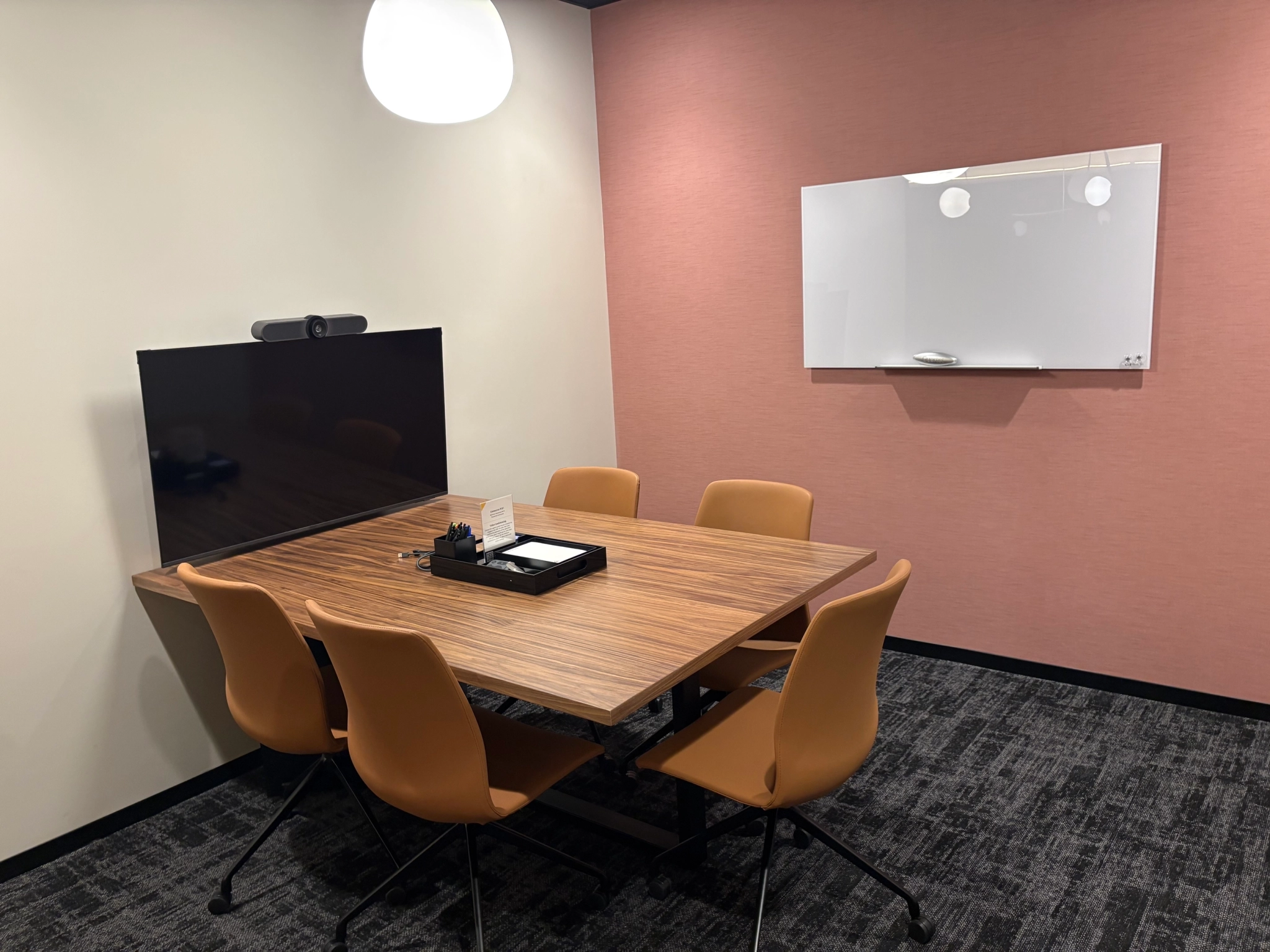 a large, bright meeting room with a large screen