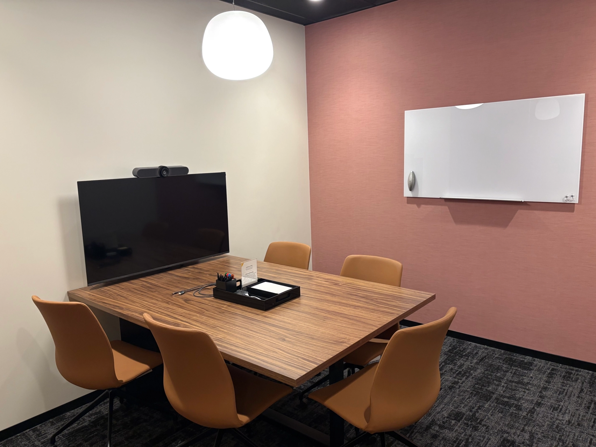 a large, bright meeting room with a large screen