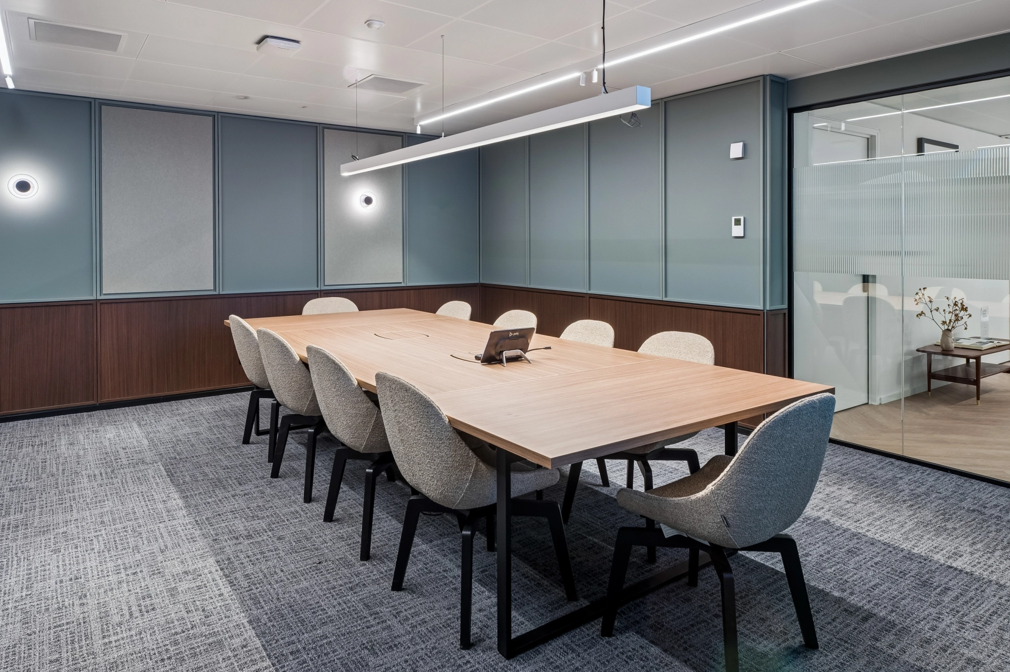 a large, bright meeting room with a large screen