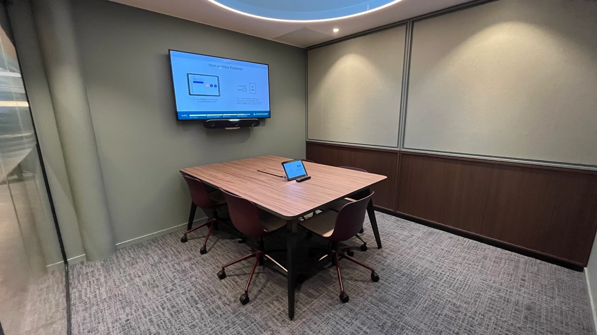 a large, bright meeting room with a large screen