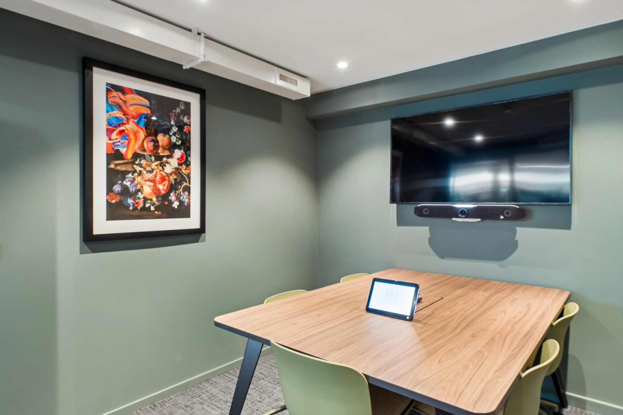 a large, bright meeting room with a large screen