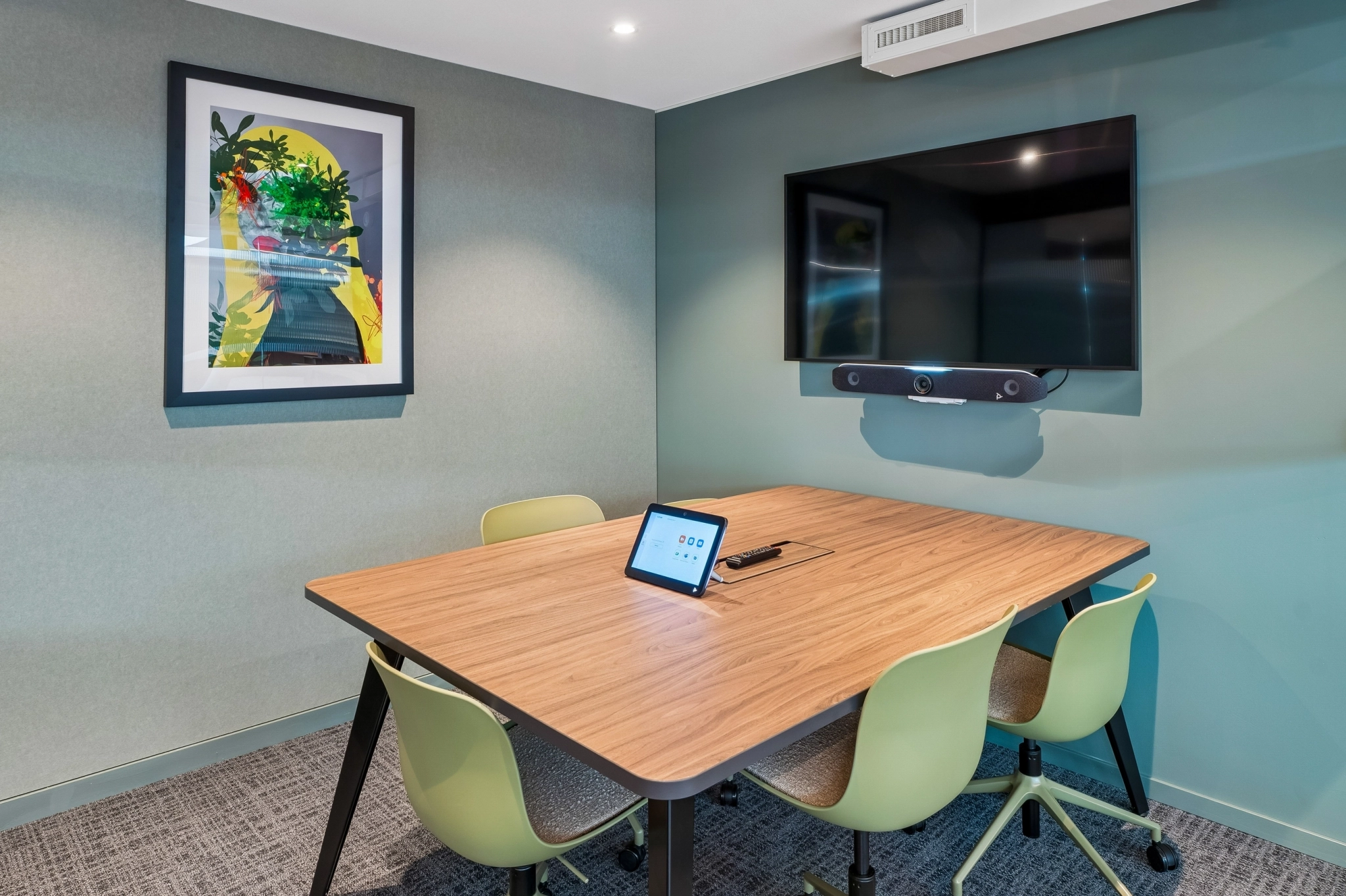 a large, bright meeting room with a large screen