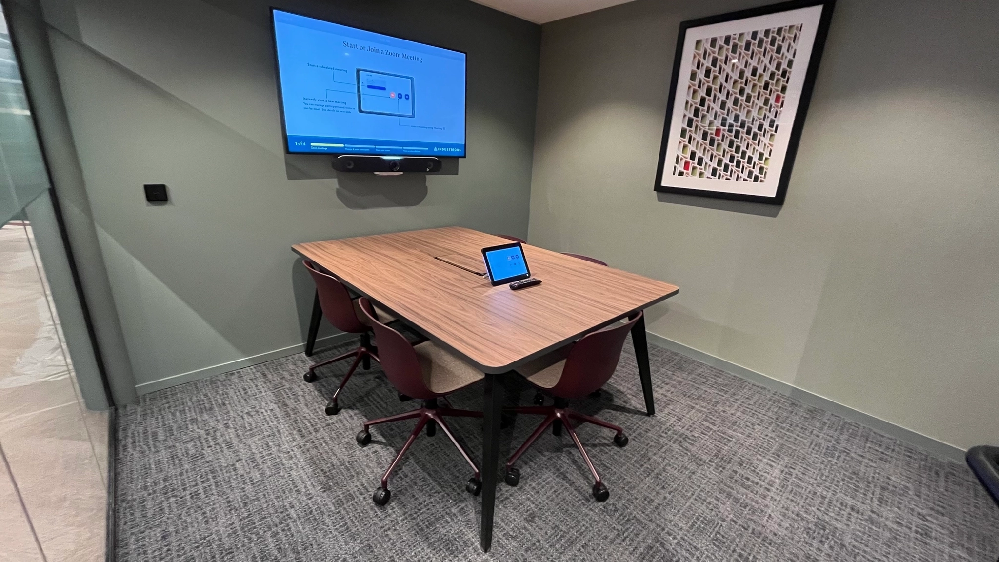 a large, bright meeting room with a large screen