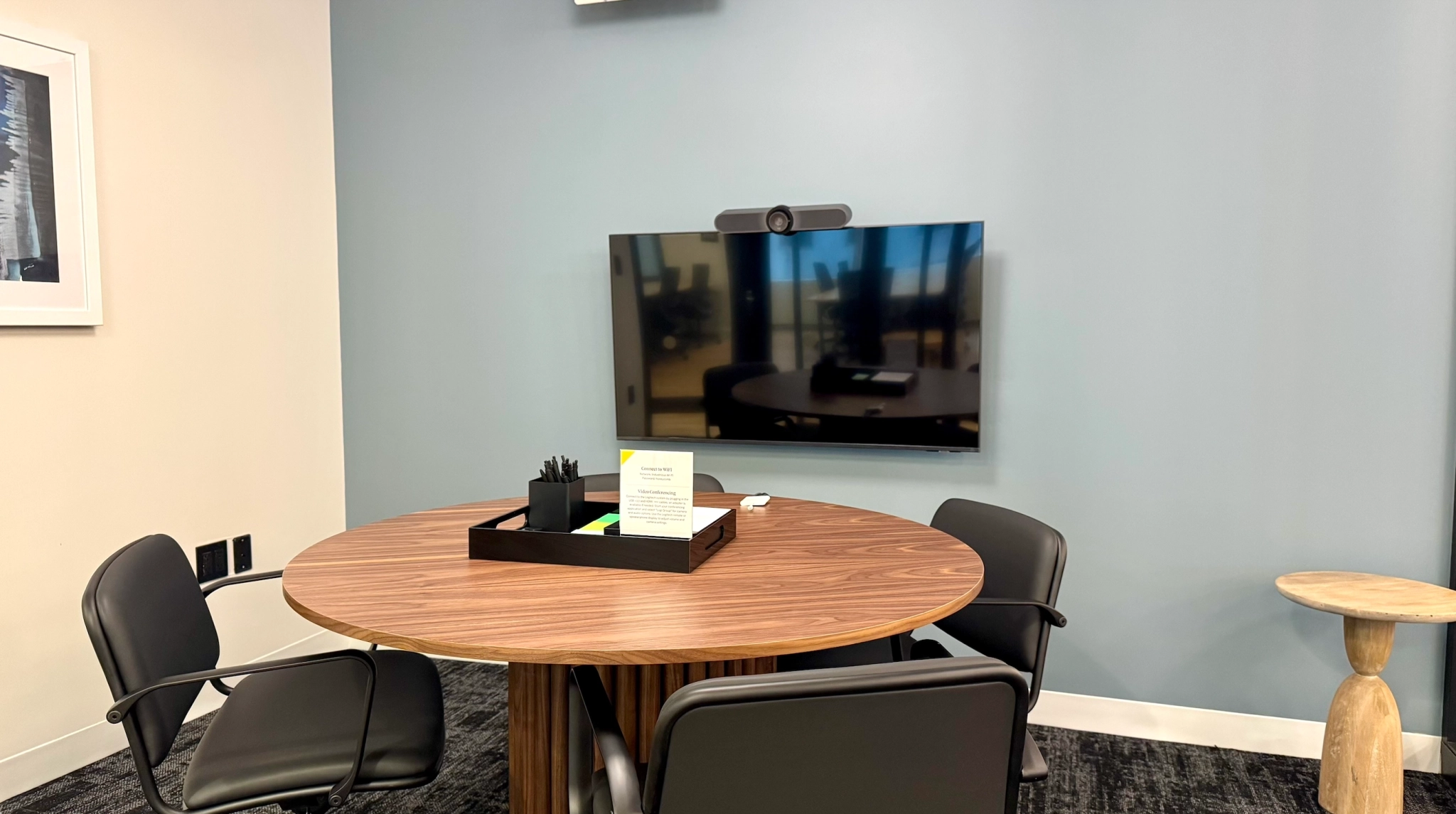a large, bright meeting room with a large screen