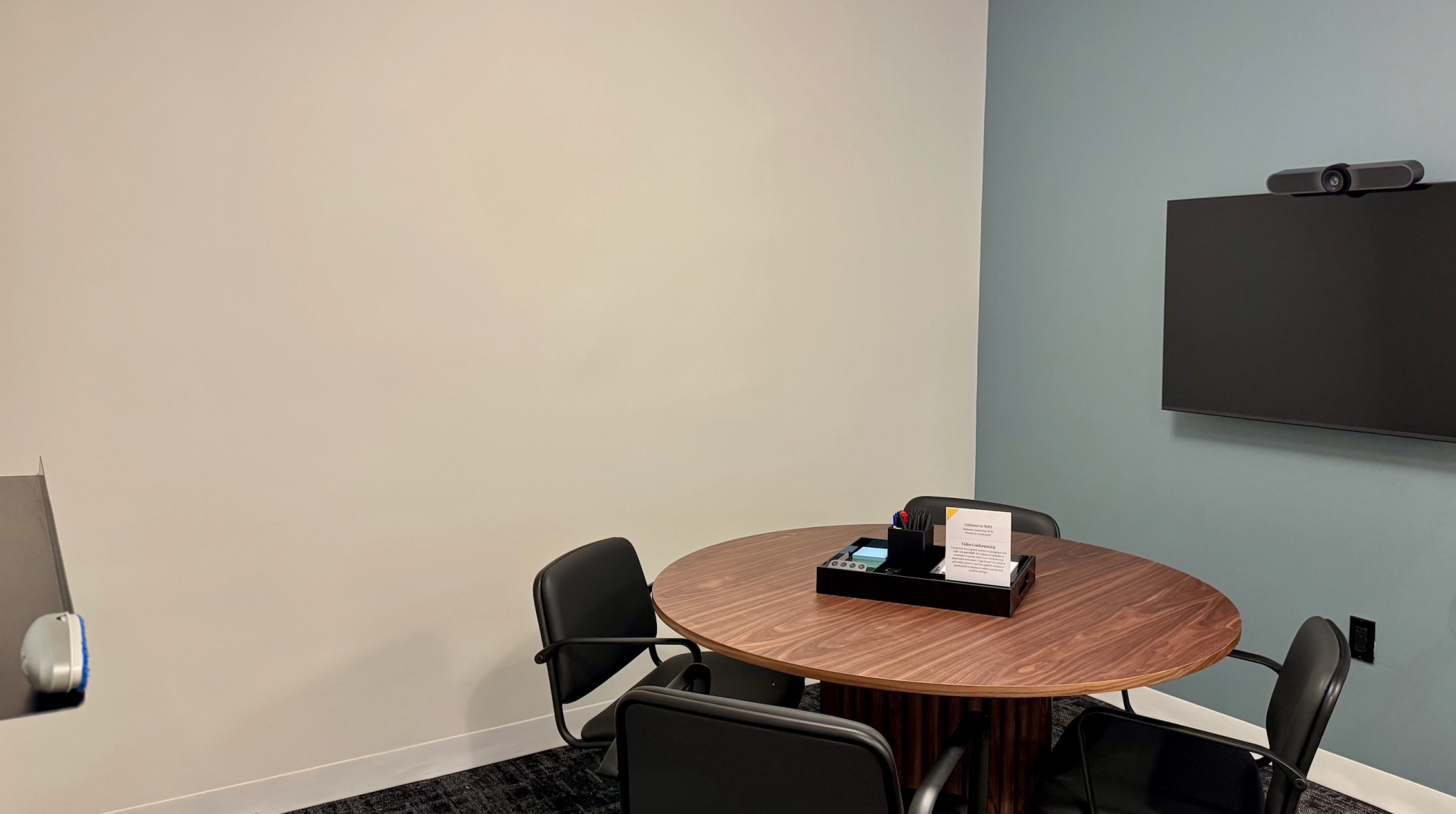 a large, bright meeting room with a large screen