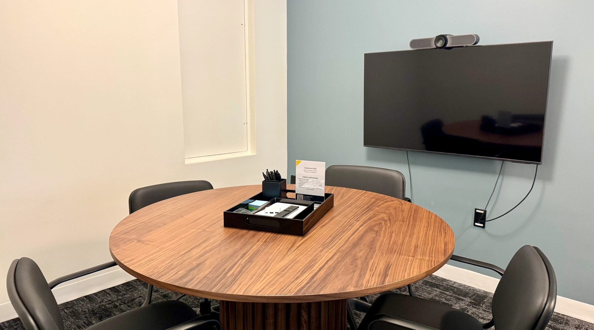 a large, bright meeting room with a large screen