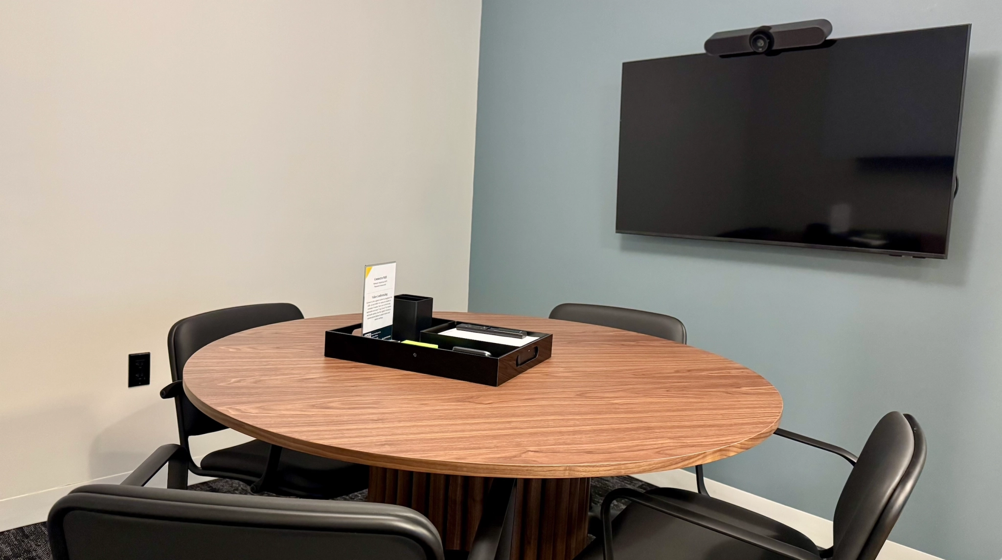 a large, bright meeting room with a large screen