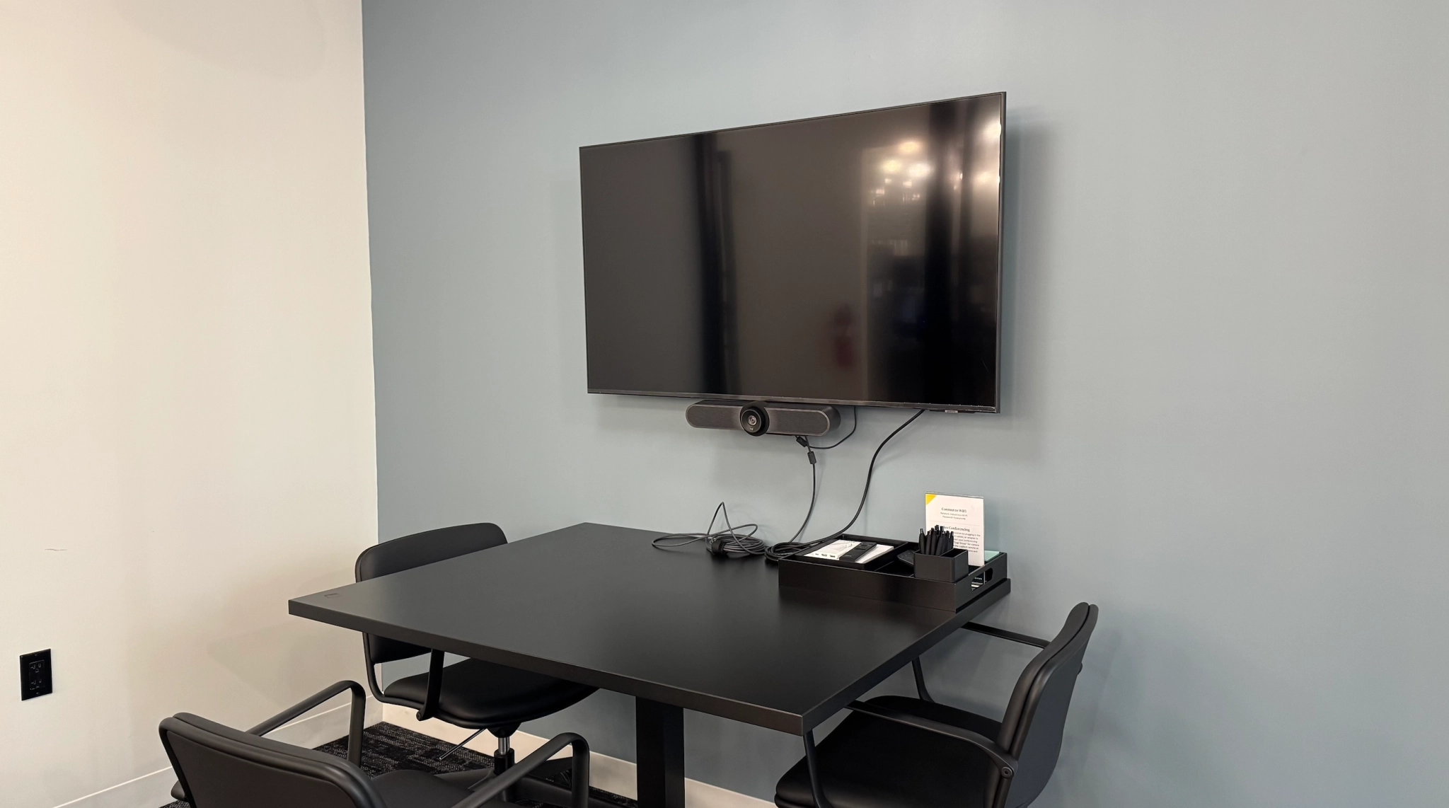 a large, bright meeting room with a large screen