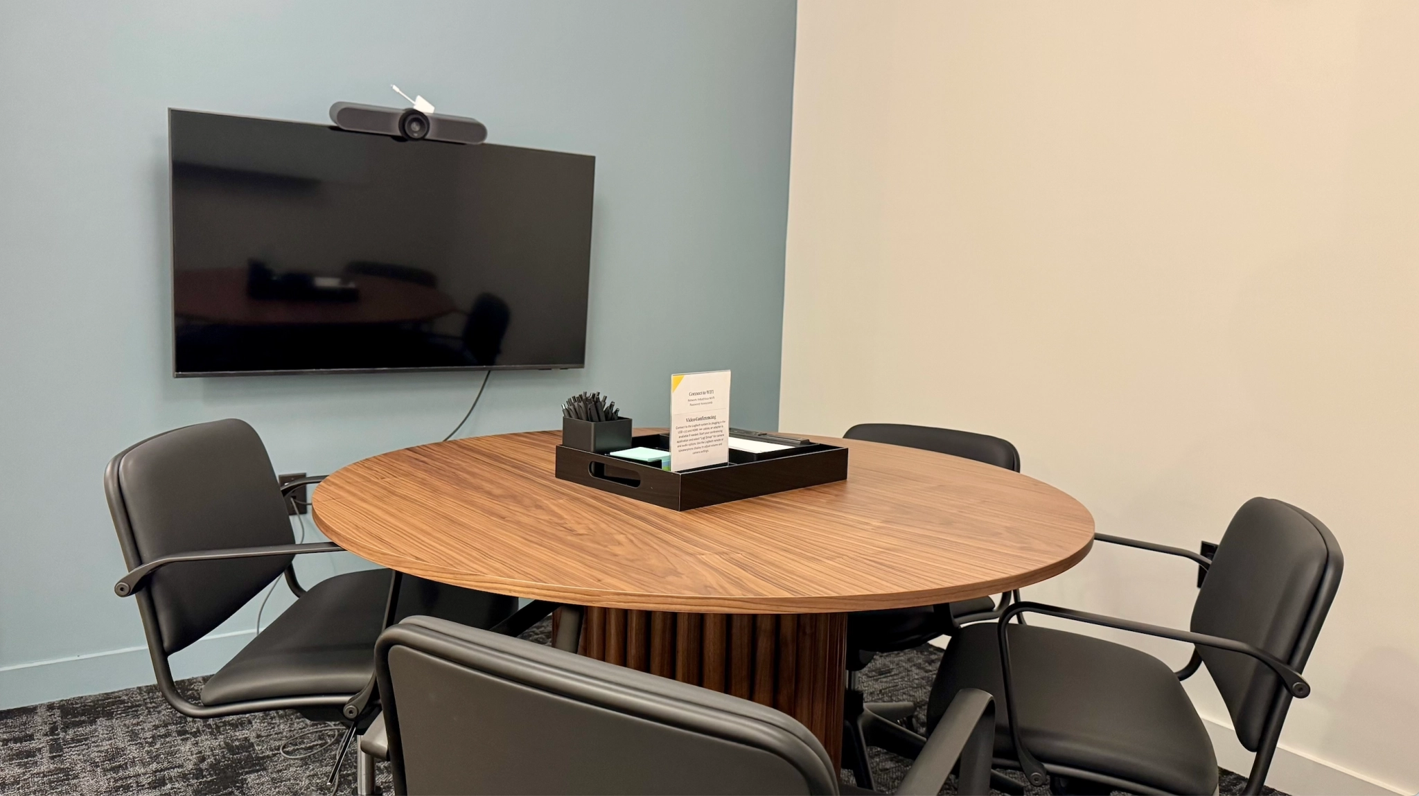 a large, bright meeting room with a large screen