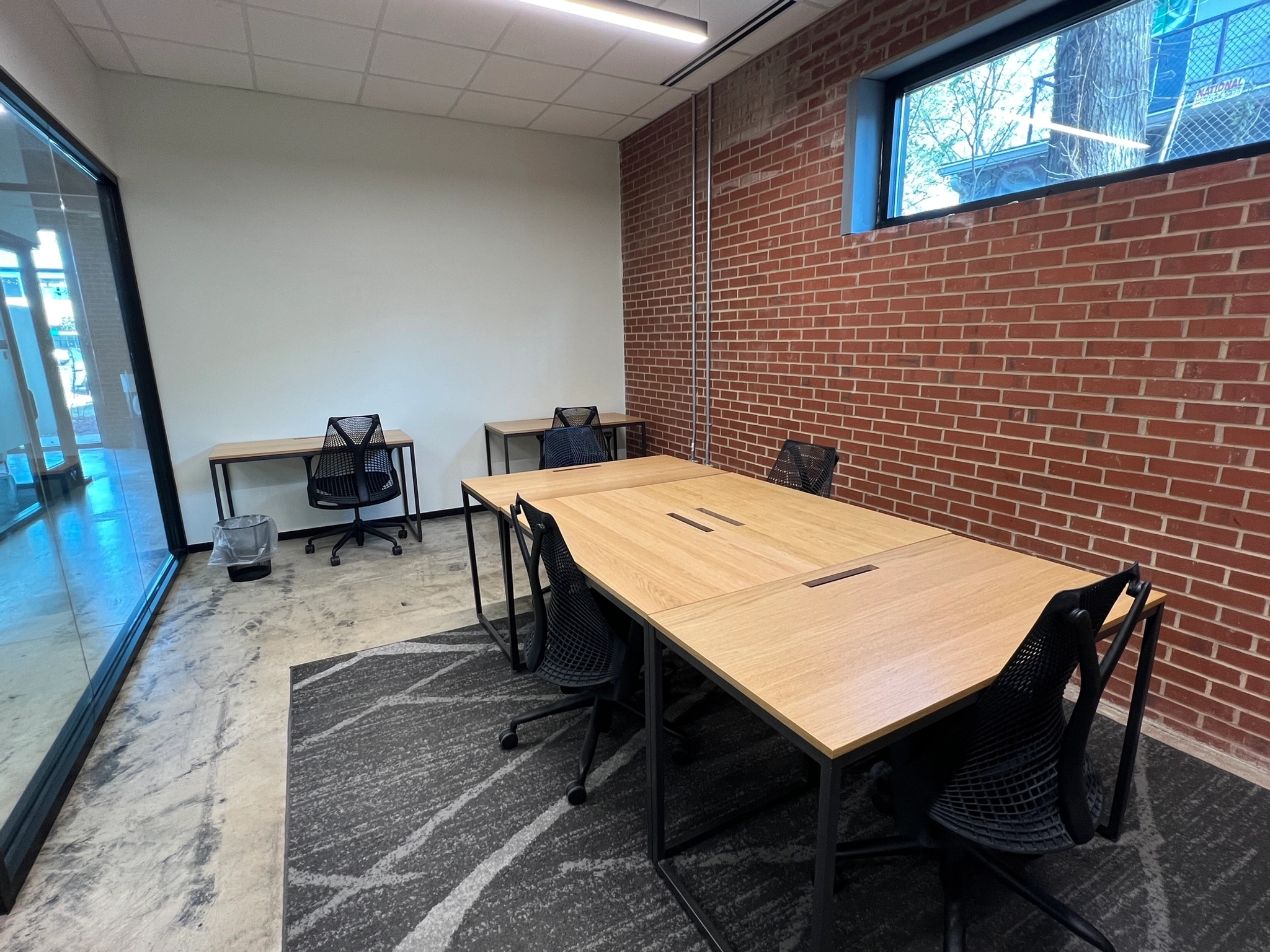 a large, bright meeting room with a large screen