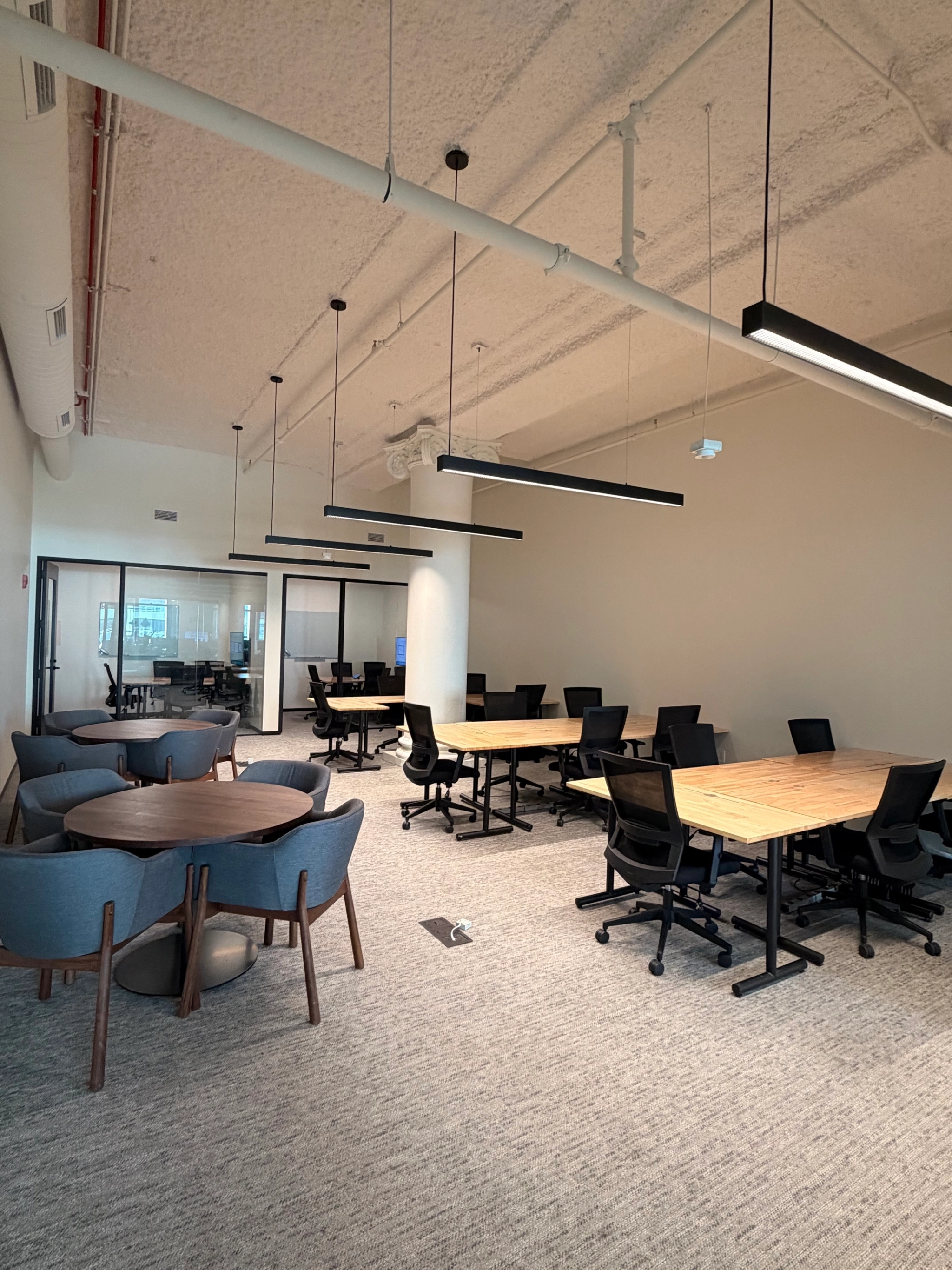 a large, bright meeting room with a large screen
