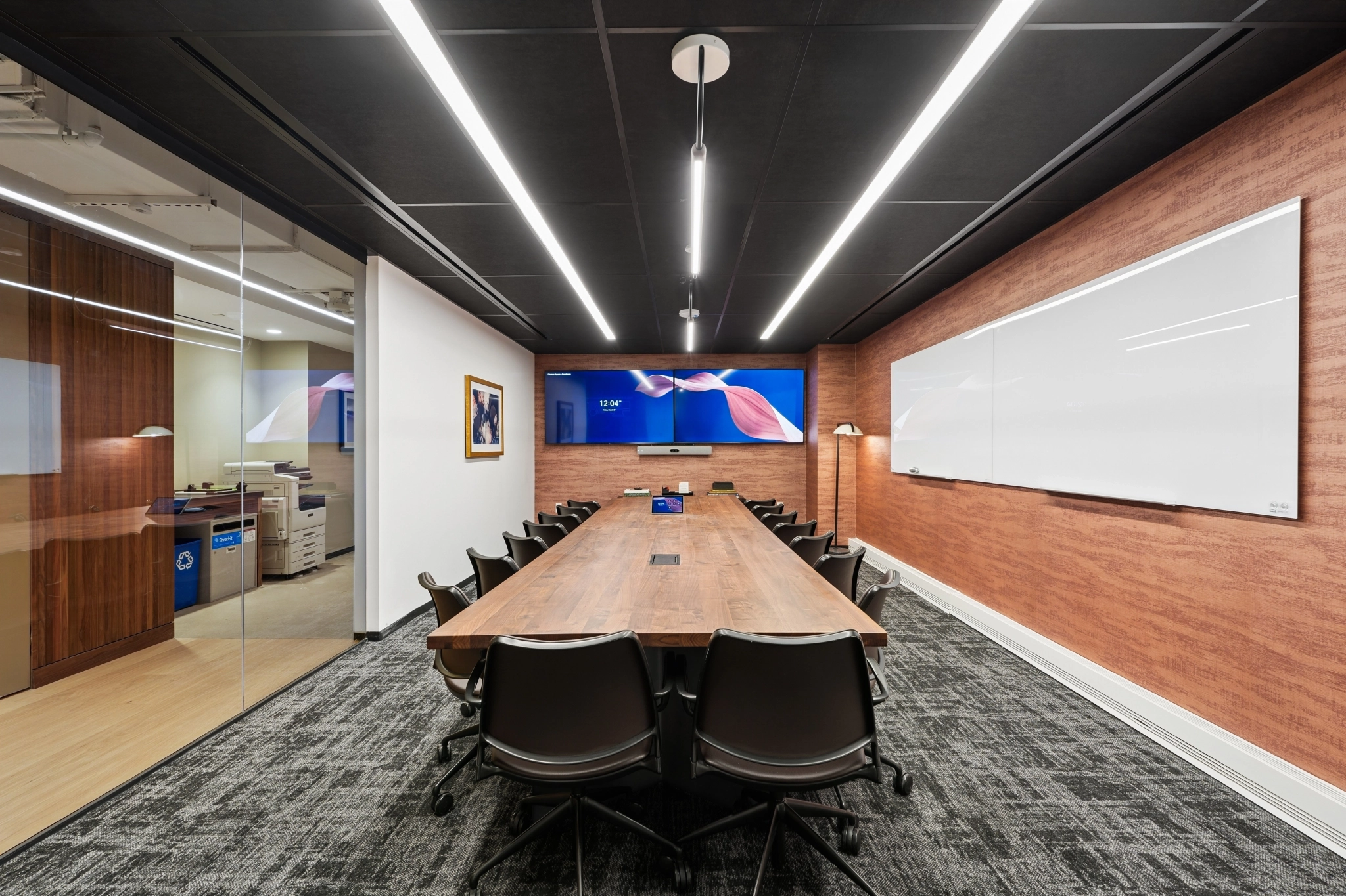 a large, bright meeting room with a large screen