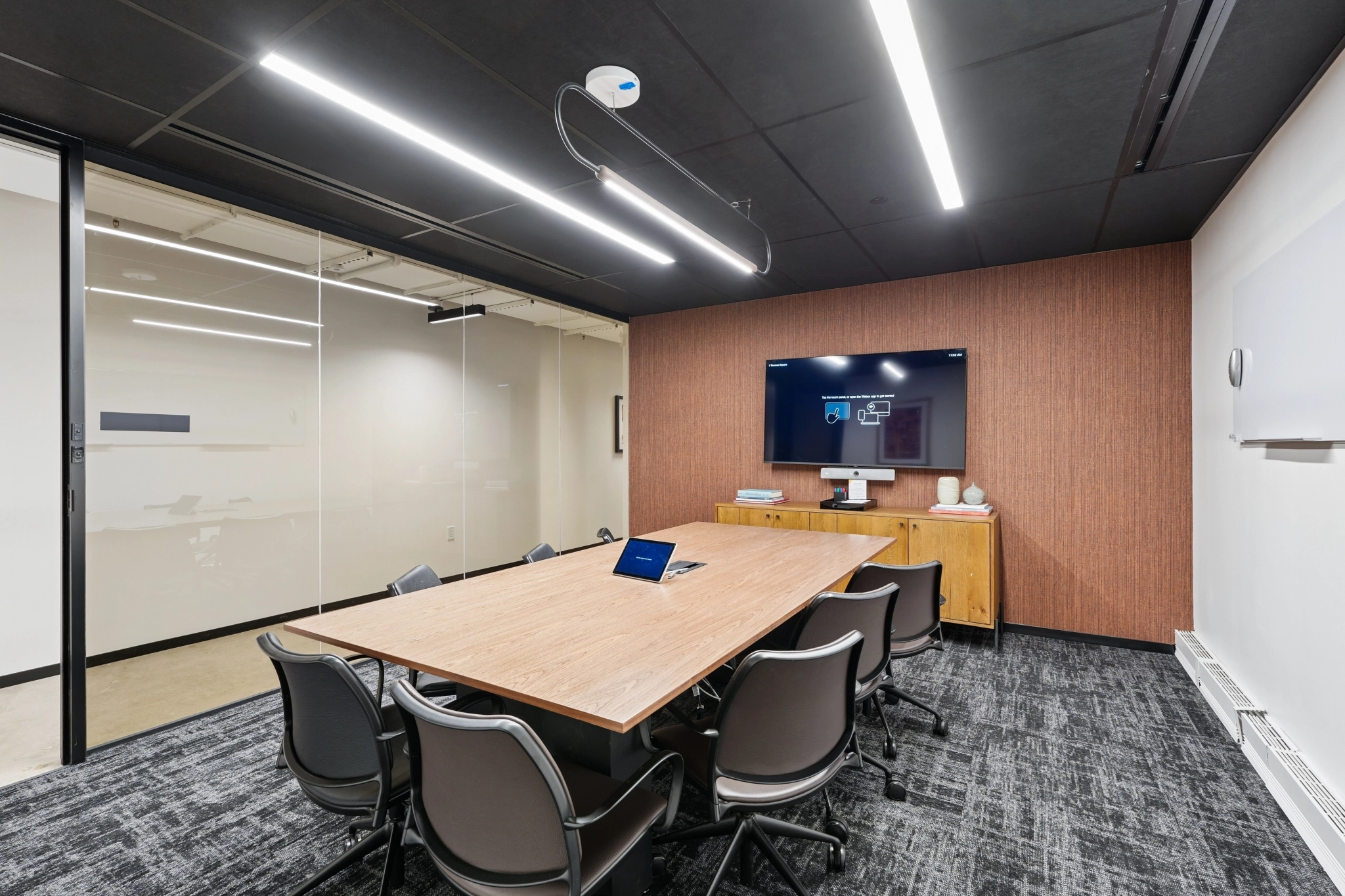 a large, bright meeting room with a large screen