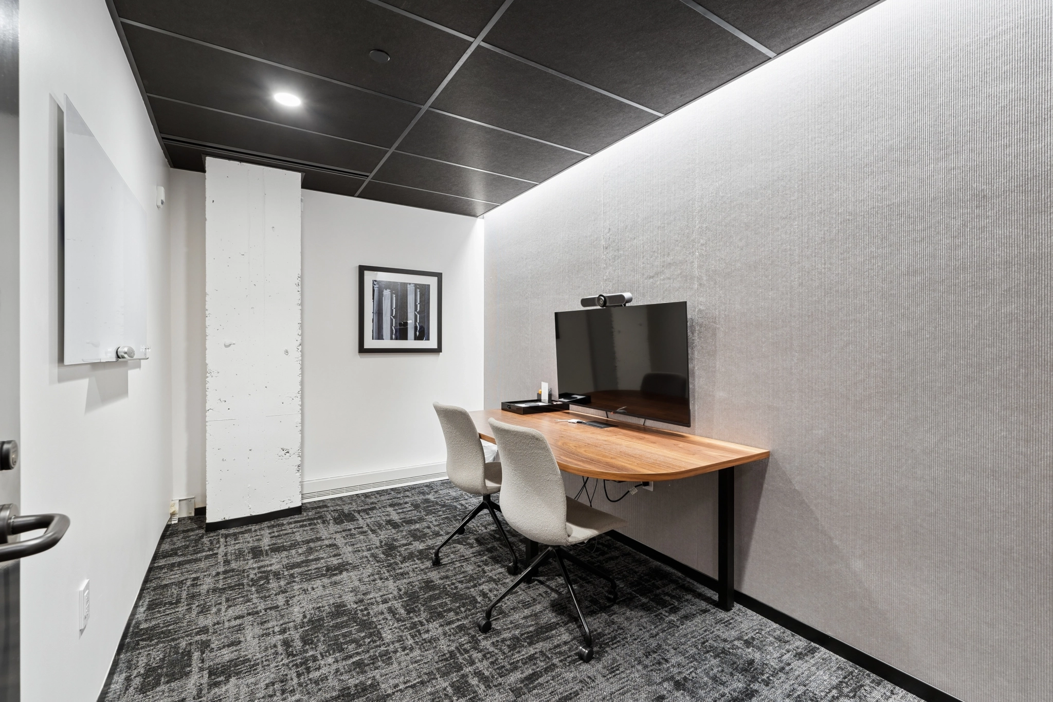 a large, bright meeting room with a large screen