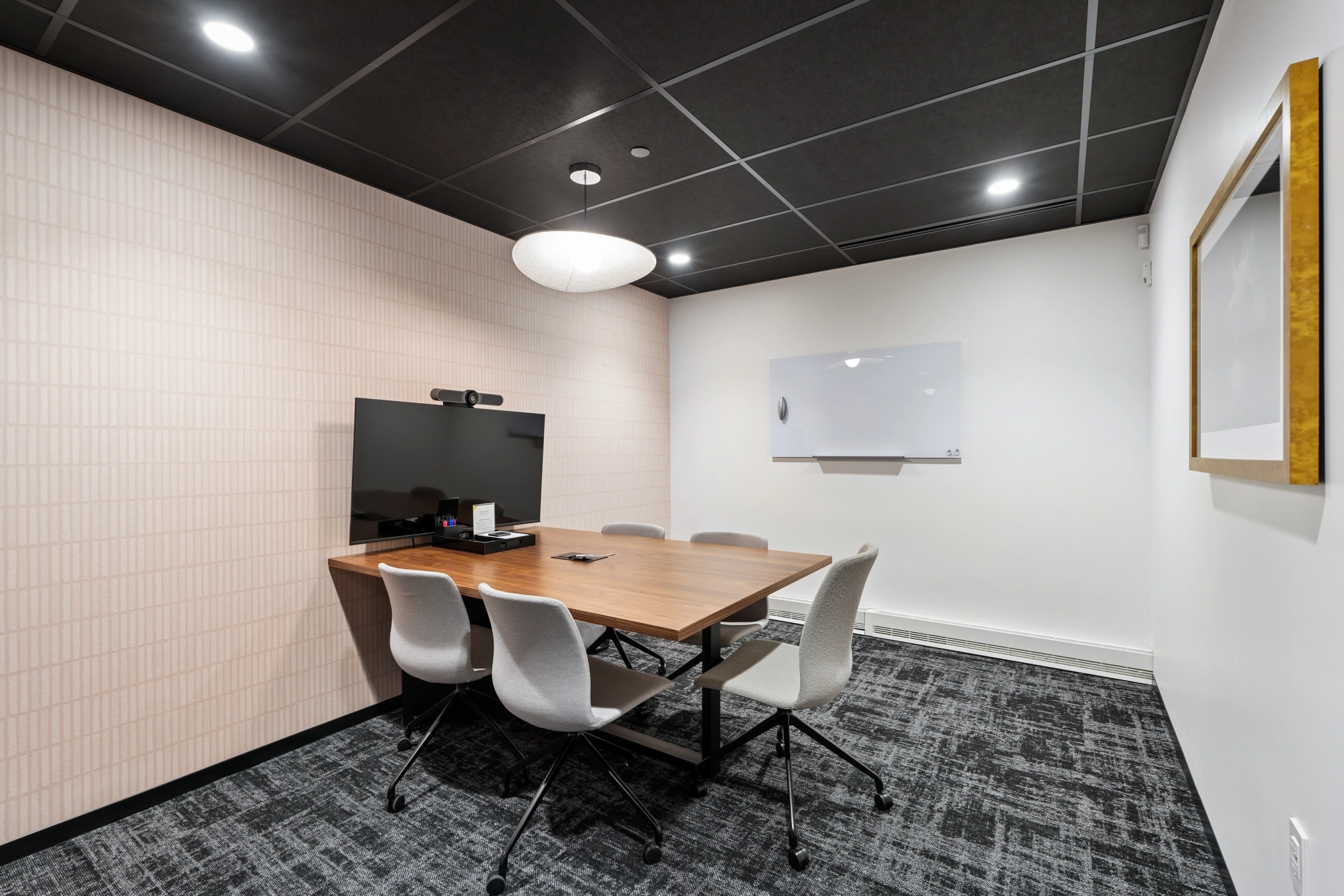 a large, bright meeting room with a large screen
