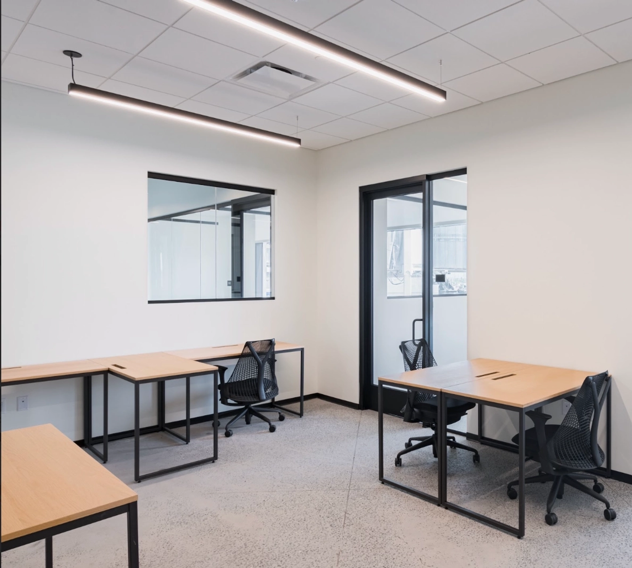 a large, bright meeting room with a large screen