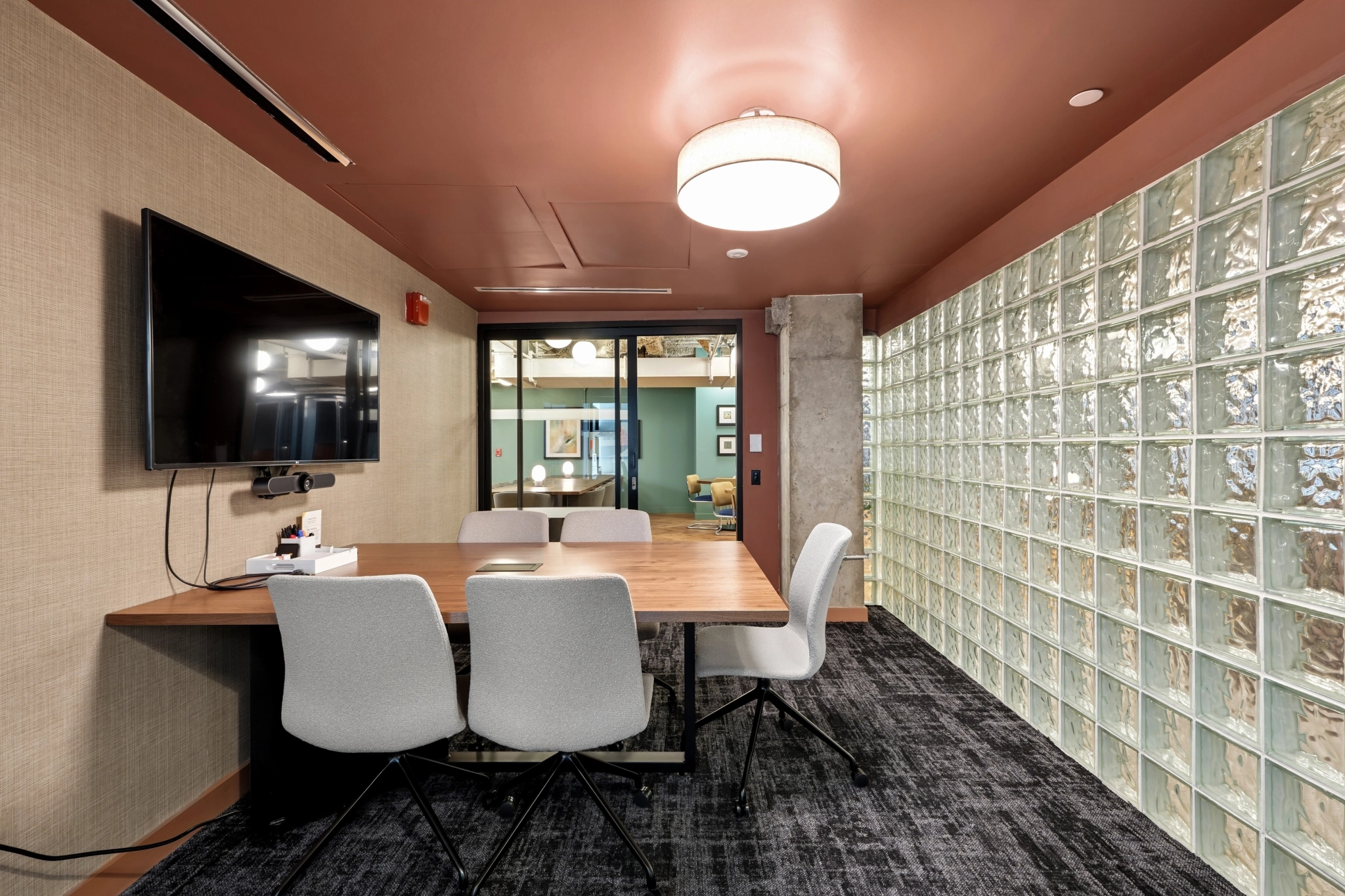 a large, bright meeting room with a large screen