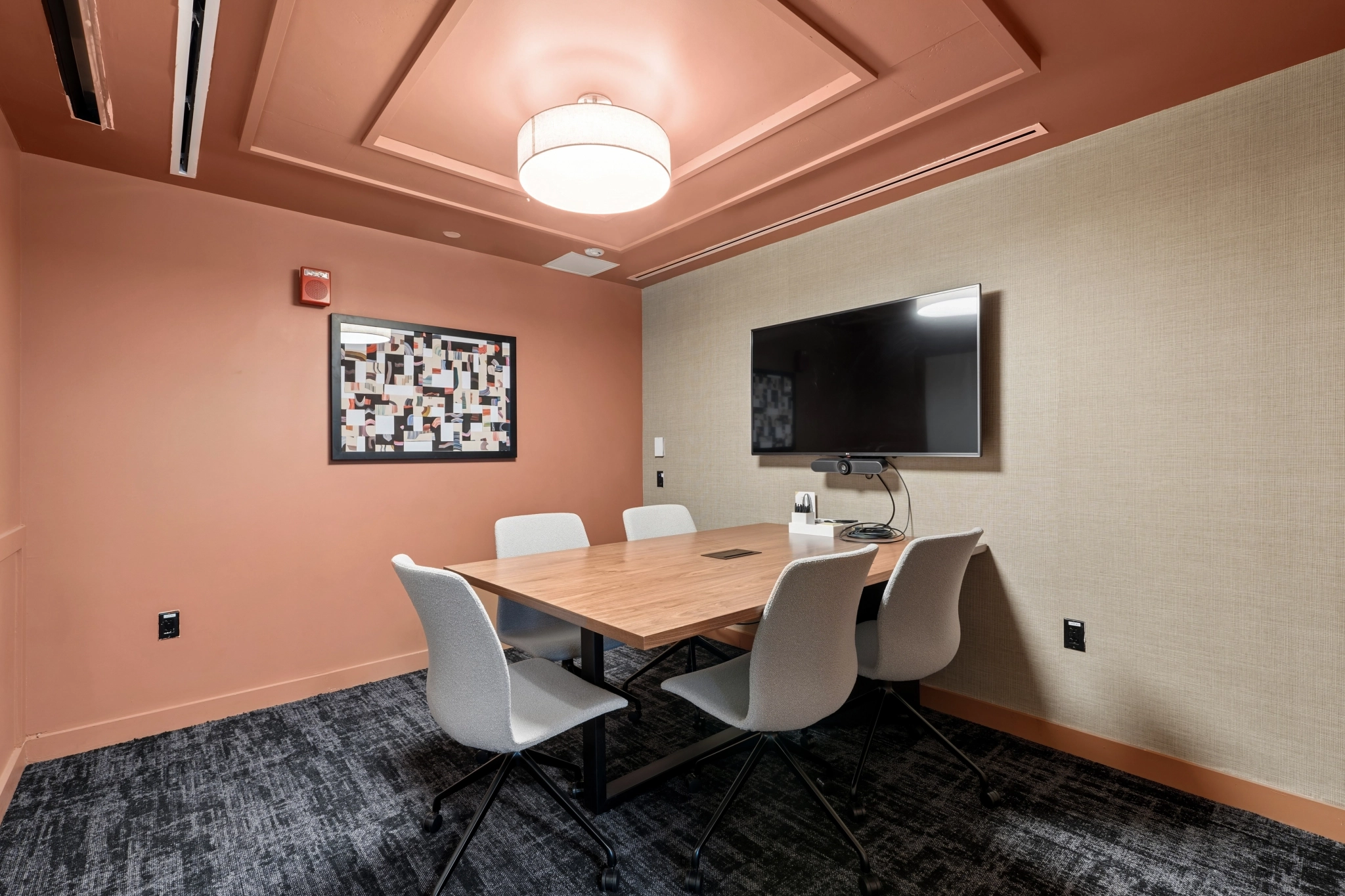 a large, bright meeting room with a large screen