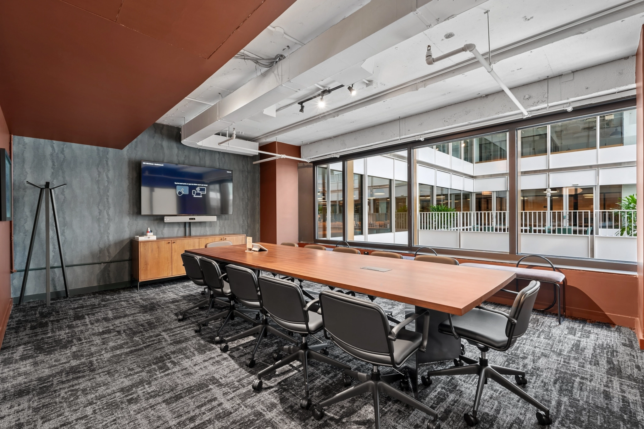 a large, bright meeting room with a large screen