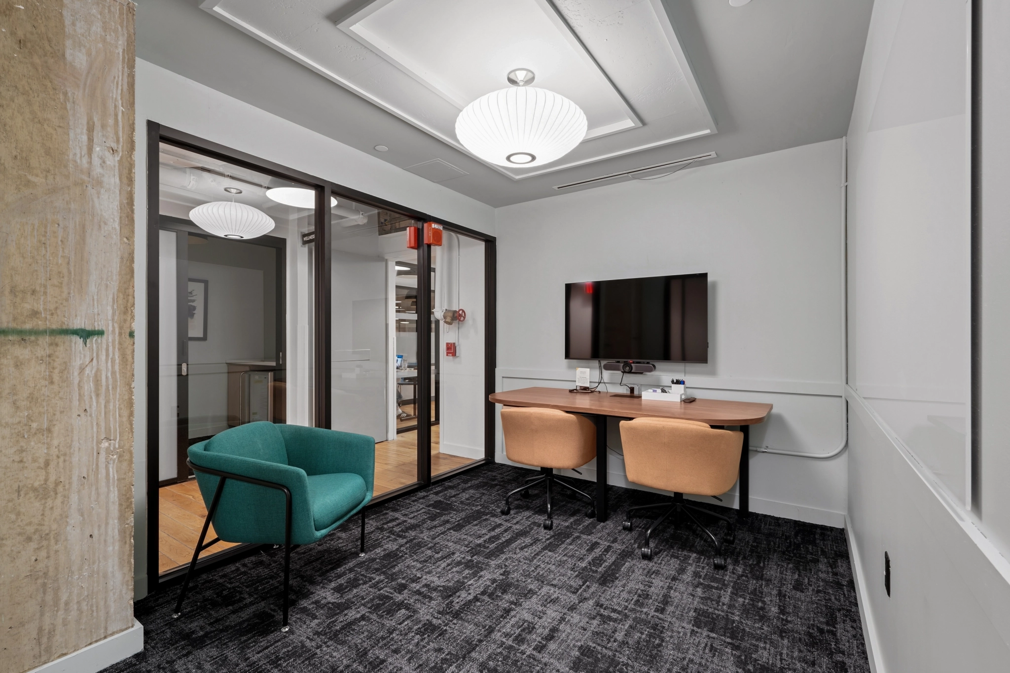 a large, bright meeting room with a large screen