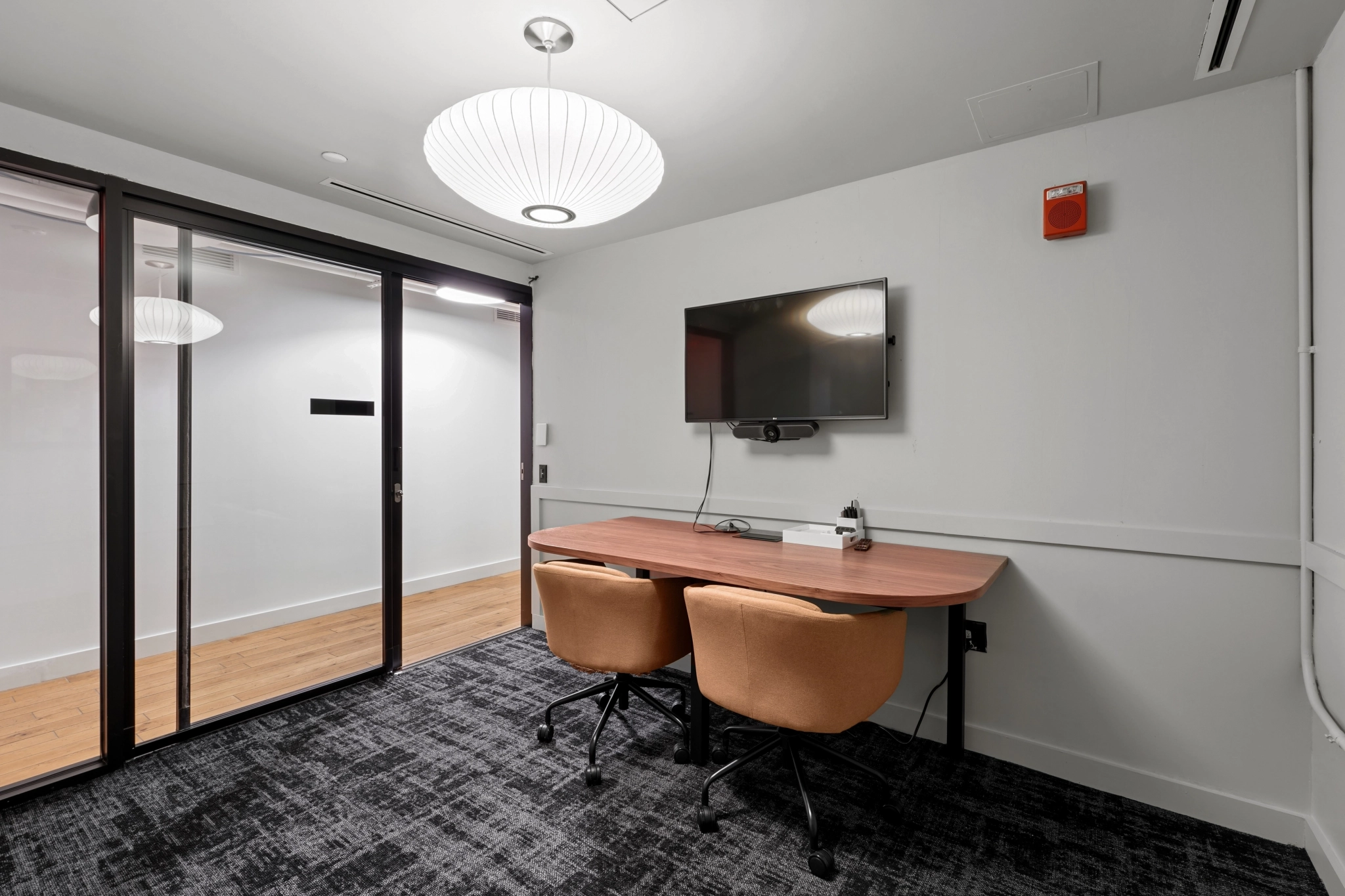 a large, bright meeting room with a large screen
